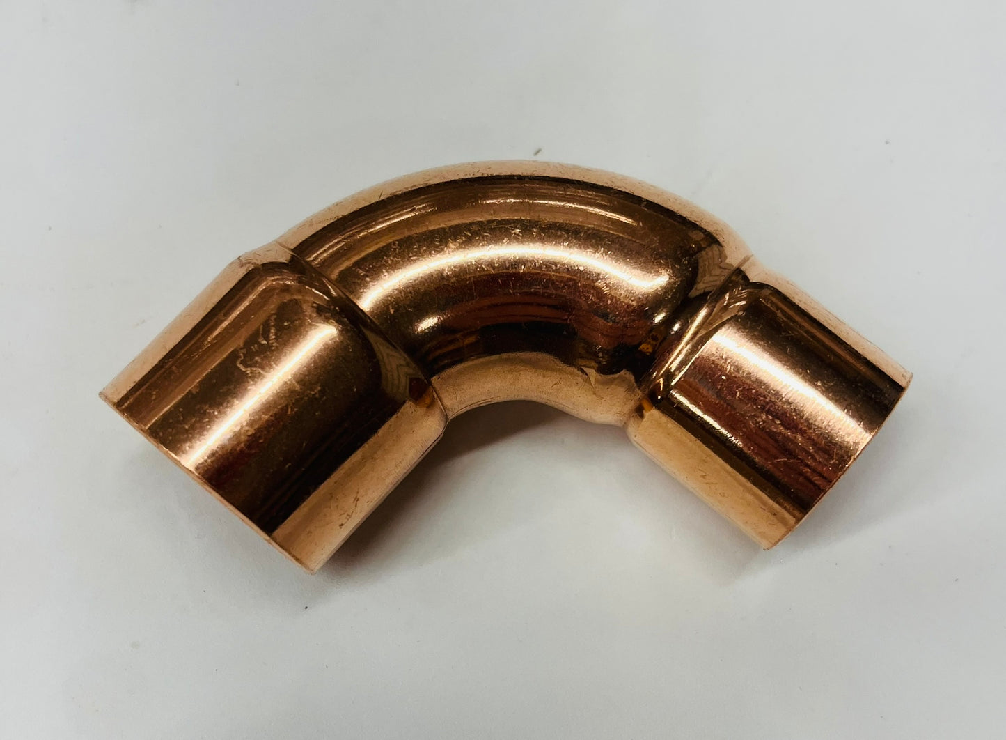 Jones Stephens 1-1/4" x 1" Copper Reducing 90° Elbow – Rough Close CxC
