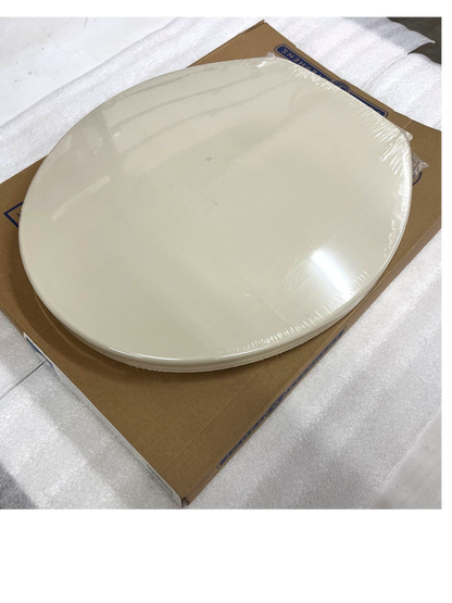 North Country Supply Jones Stephens bone plastic round toilet seat with cover in original packaging.