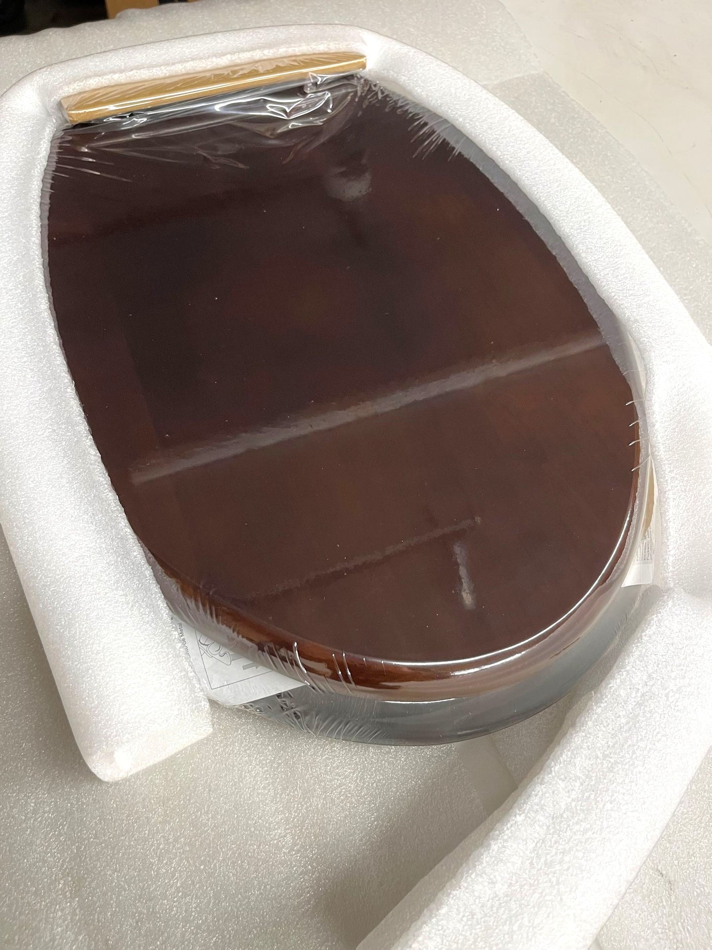 North Country Supply dark brown wooden toilet seat with lid and polished chrome hinges, oval shape.
