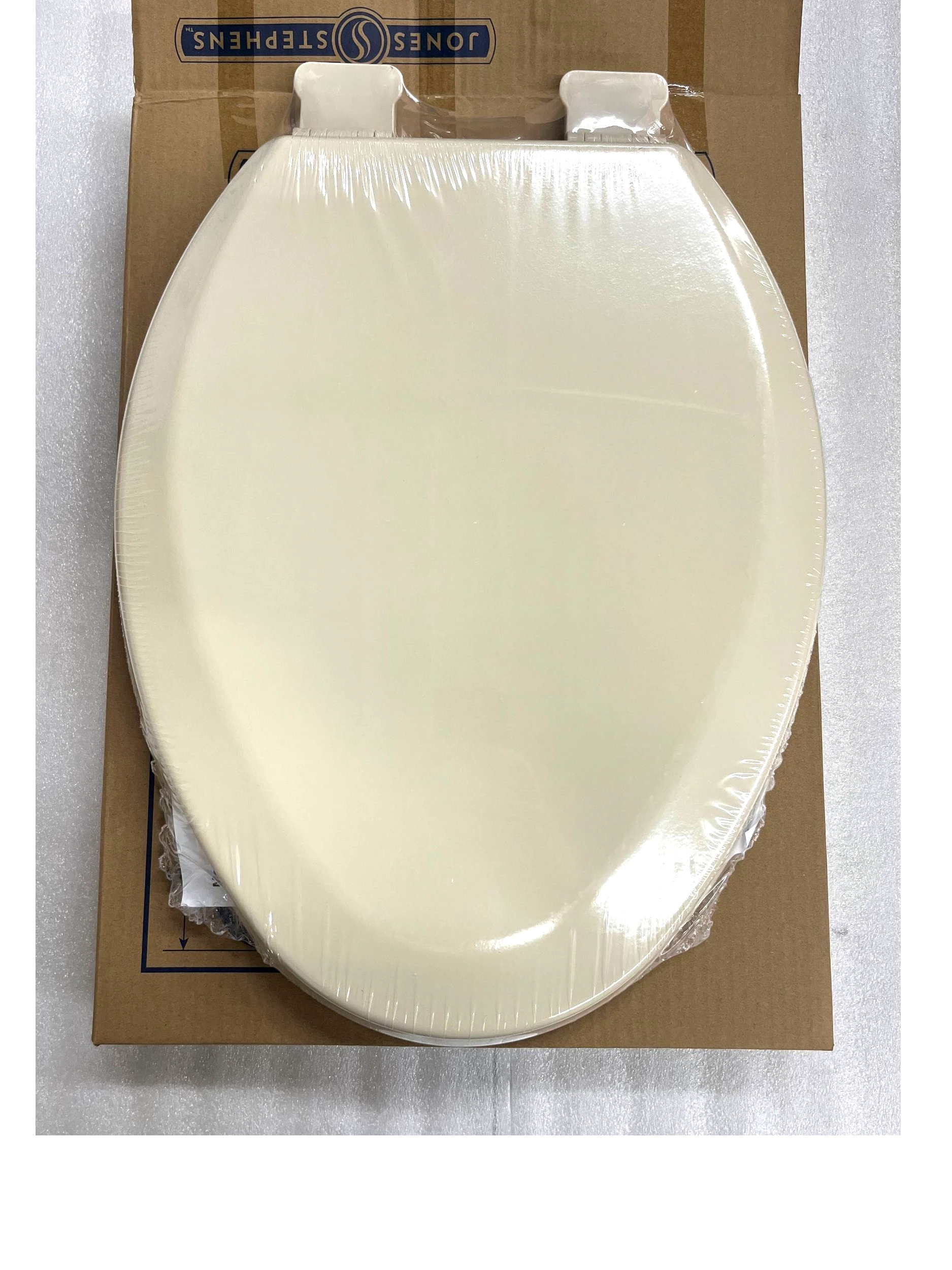 North Country Supply Jones Stephens elongated molded wood toilet seat in bone finish with QuickLean hinges.
