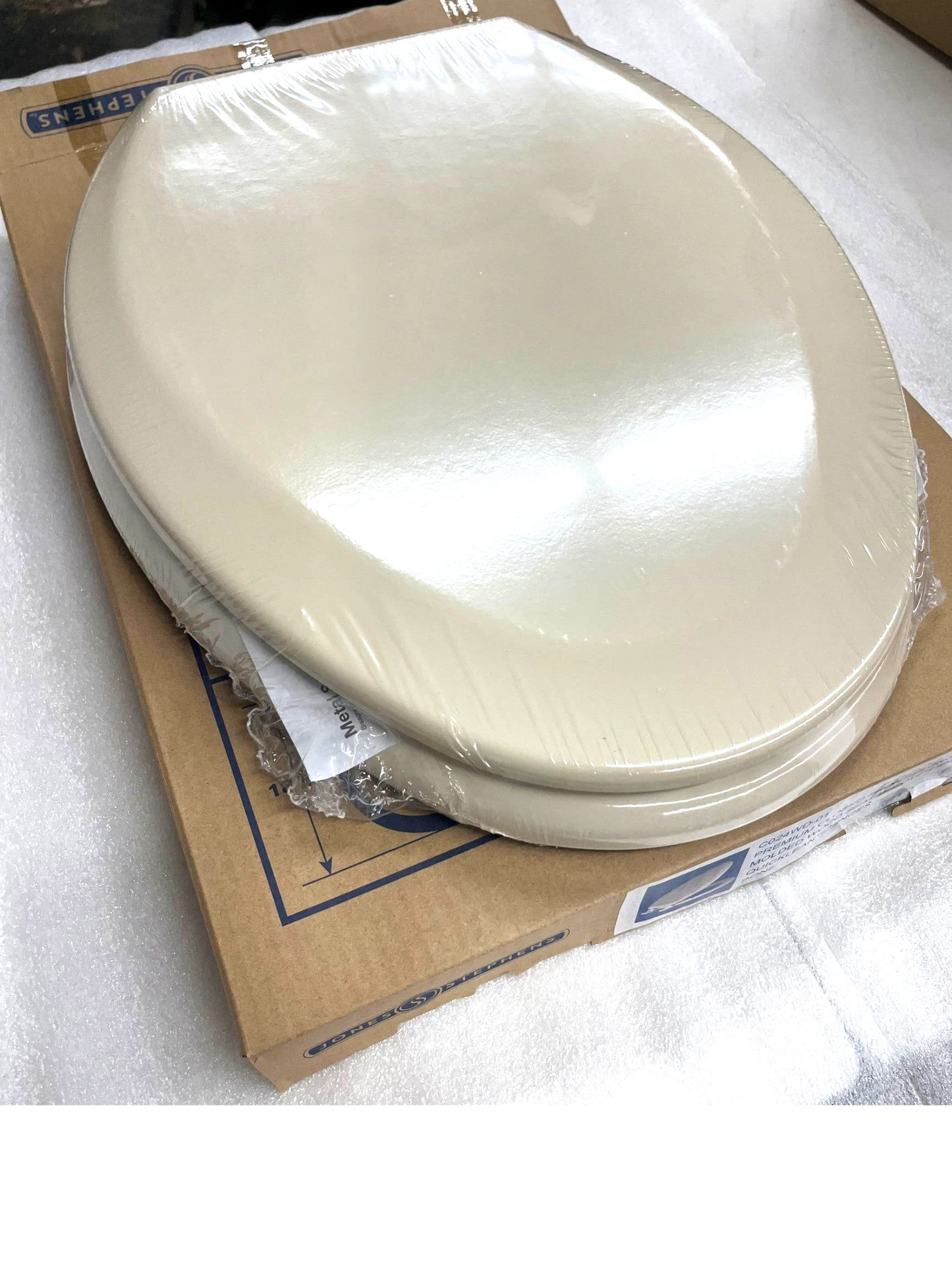 North Country Supply JONES STEPHENS elongated molded wood toilet seat in bone finish with QuickLean hinges.