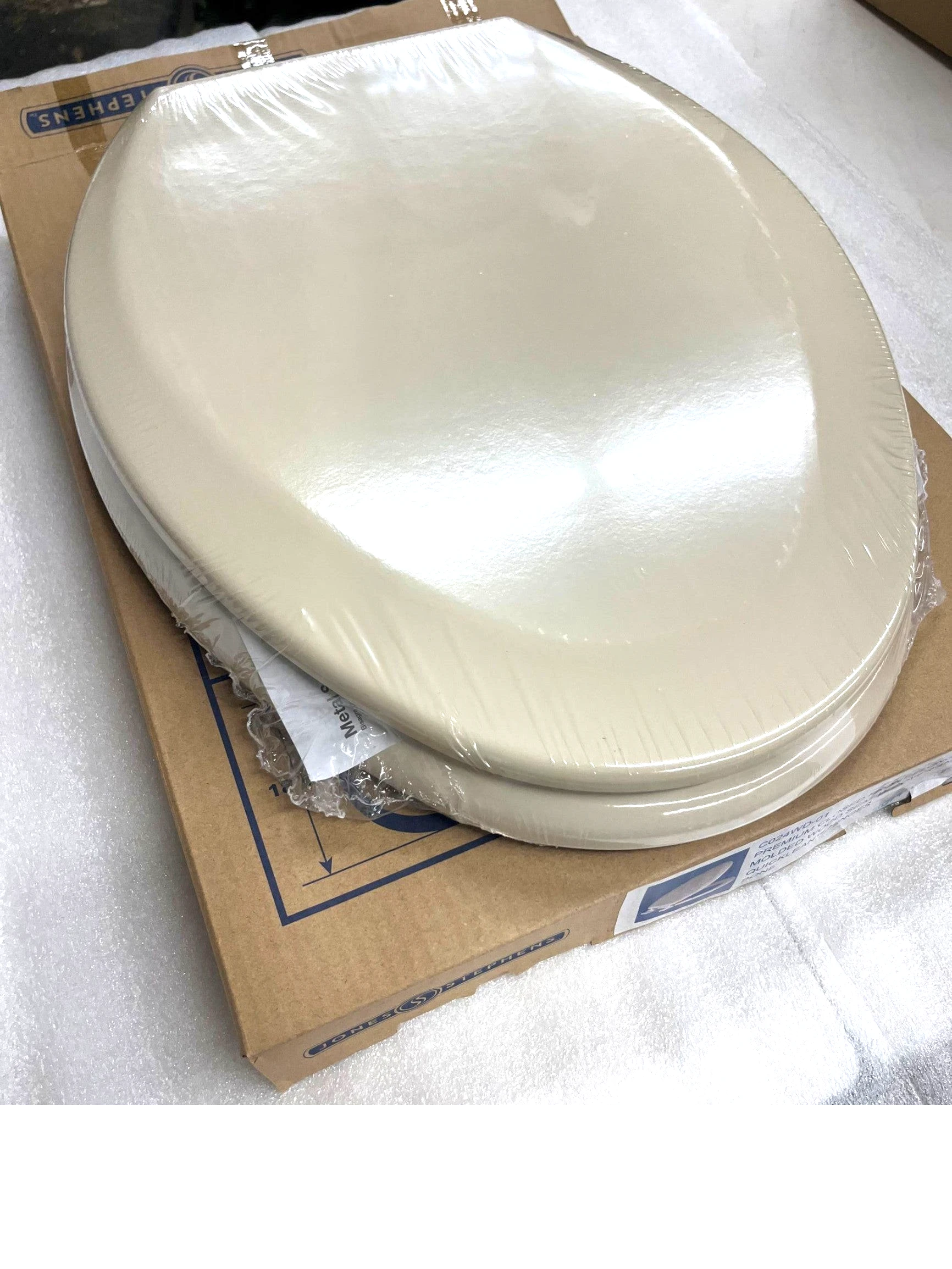 North Country Supply JONES STEPHENS elongated molded wood toilet seat in bone finish with QuickLean hinges.
