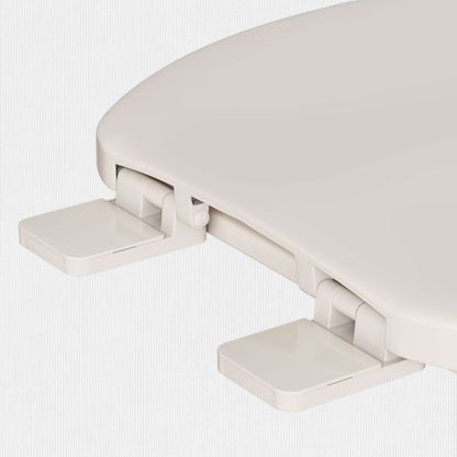 North Country Supply Jones Stephens round plastic toilet seat in bone with closed-front cover and hinge detail.