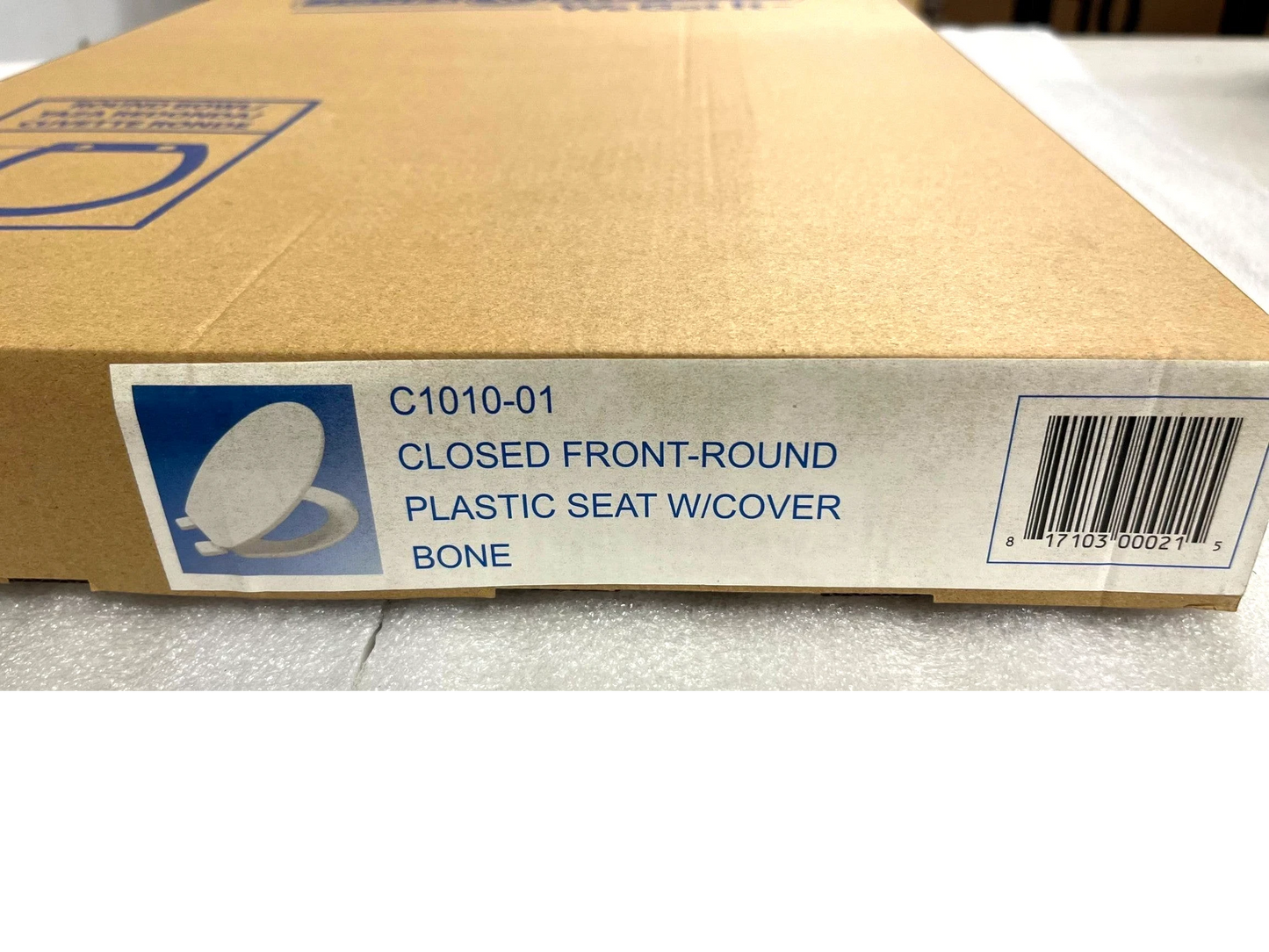 North Country Supply Jones Stephens bone plastic round toilet seat with cover in original cardboard packaging