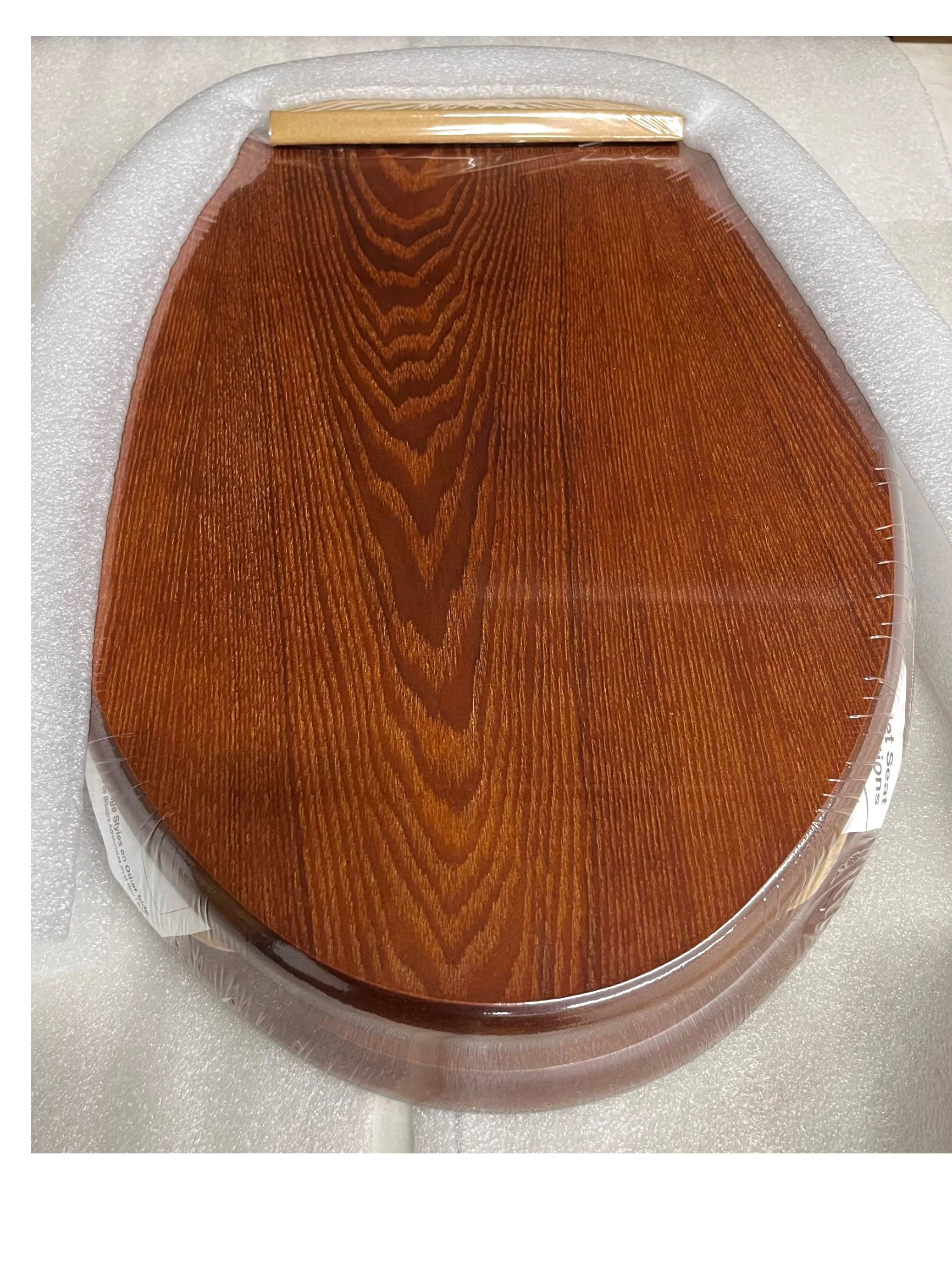 North Country Supply Decorative Wood Toilet Seat in cherry finish with brushed nickel hinges for elongated bowls.